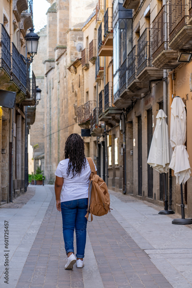 Tourist woman walking around Ciudad Rodrigo in Salamanca.