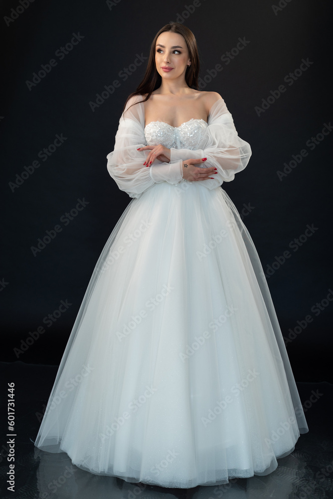 Perfect bride in wedding dress on black background Perfect bride in wedding dress on black background