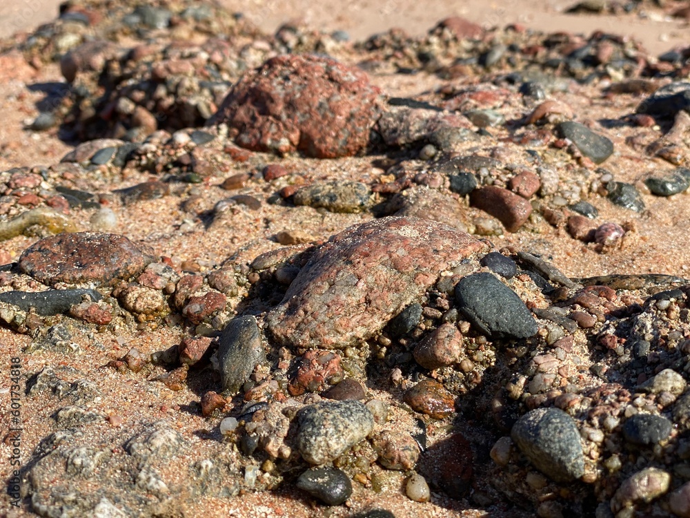 Background of textural multi-colored stones on the shore of the Red Sea in Sharm El Sheikh Background of textural multi-colored stones on the shore of the Red Sea in Sharm El Sheikh