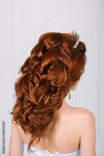 Close-up of luxurious bridal texture hairstyle on long red hair