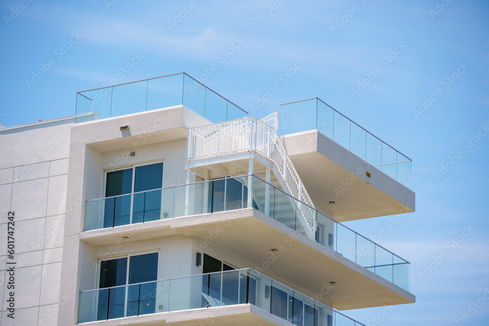 Closeup of a building with balcony and stairway to rooftop Closeup of a building with balcony and stairway to rooftop