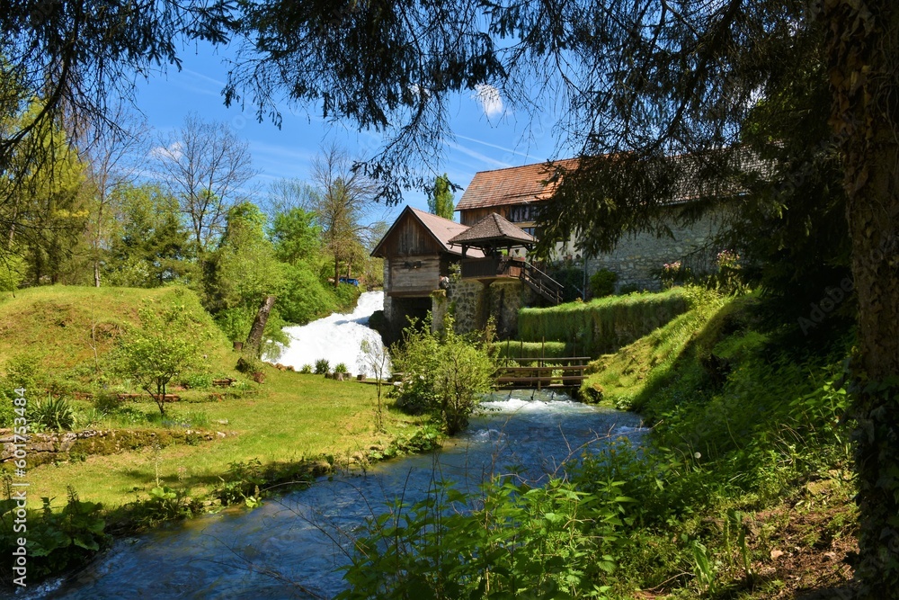 Buildings in the town of Slunj in Karlovac county, Croatia with a stream flowing next to the buildings