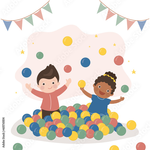 Funny multiethnic kids sits and plays in pool with plastic balls. Children birthday party in entertaining playroom. Colored play balls for small children.