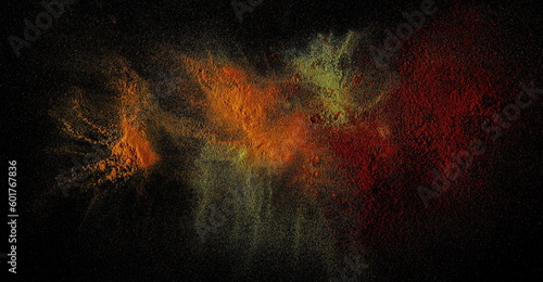 Fototapeta Naklejka Na Ścianę i Meble -  Various spice explosion, turmeric, ground lemongrass, cayenne pepper isolated on black background and texture