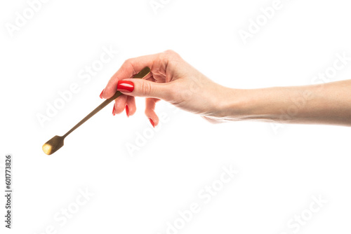 Coffee spoon in hand on white background