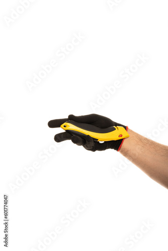 Segmented blade or snap-off blade utility knife in male hand isolated on white background.
