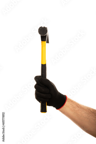 Man's hand in construction glove holding yellow hammer isolated on white background.