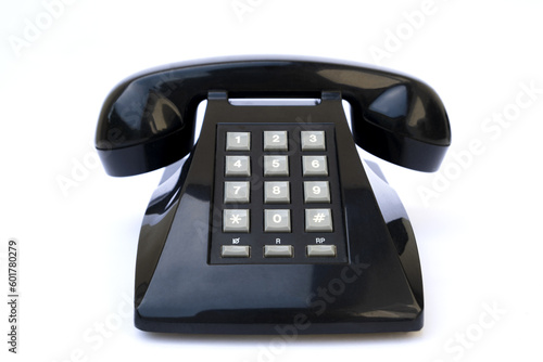 Vintage black telephone on a white background photo