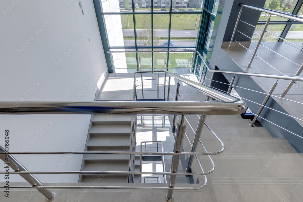stairs emergency and evacuation exit stair in up ladder in a new office building. stairs emergency and evacuation exit stair in up ladder in a new office building.