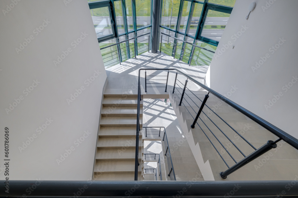 stairs emergency and evacuation exit stair in up ladder in a new office building. stairs emergency and evacuation exit stair in up ladder in a new office building.