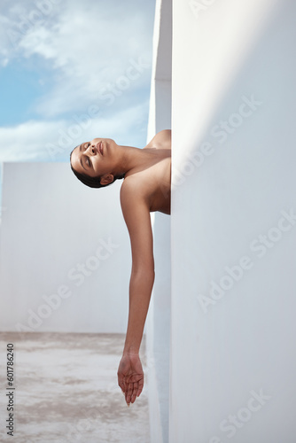 Artistic, model and nude with woman or body arm in spa building window, creative or luxury aesthetic in self-love, acceptance or empowerment. Naked or person posing for wellness art, sexy or freedom photo