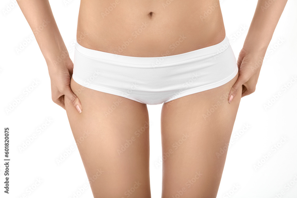 The front view female hands pinch on hips a skin, isolated The front view female hands pinch on hips a skin, isolated