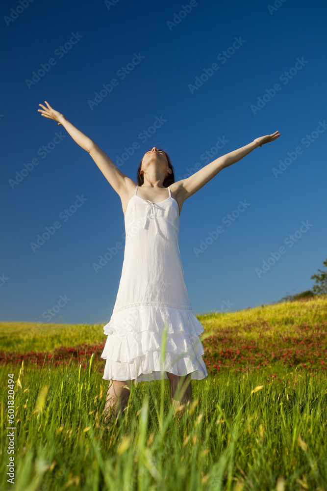 Beautiful young woman relaxing on the field Beautiful young woman relaxing on the field