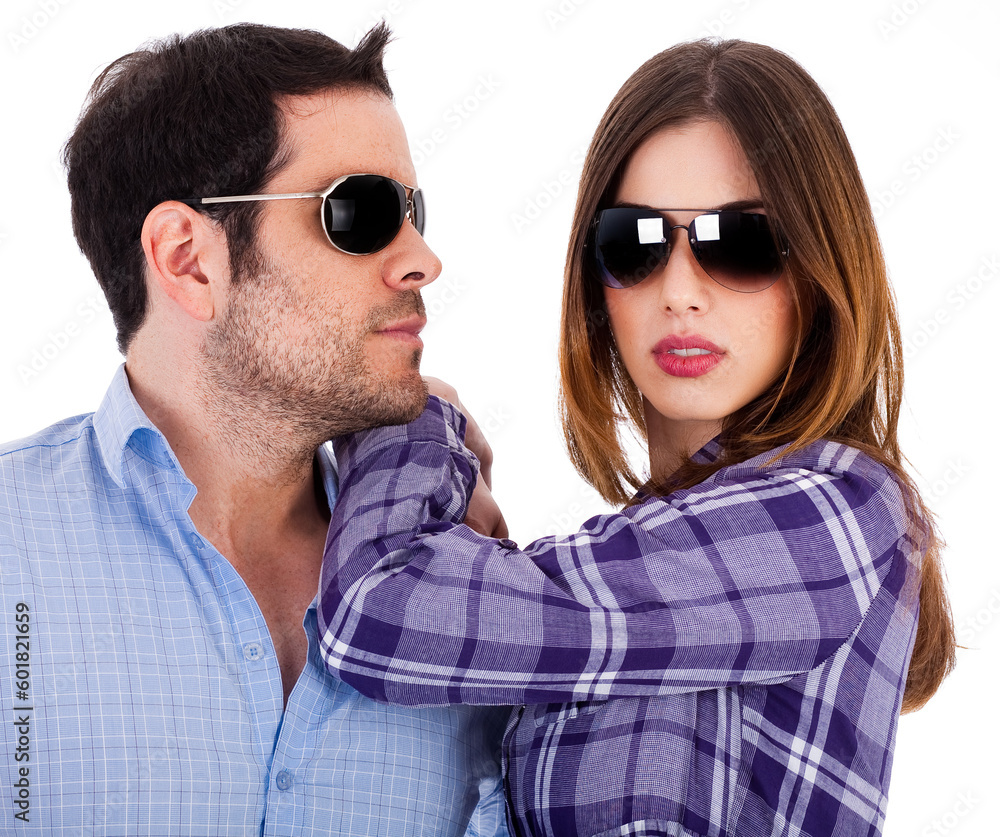 Stylish man and women wearing sunglasses indoor studio Stylish man and women wearing sunglasses indoor studio