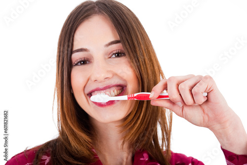 Women brushing her teeth on a white background