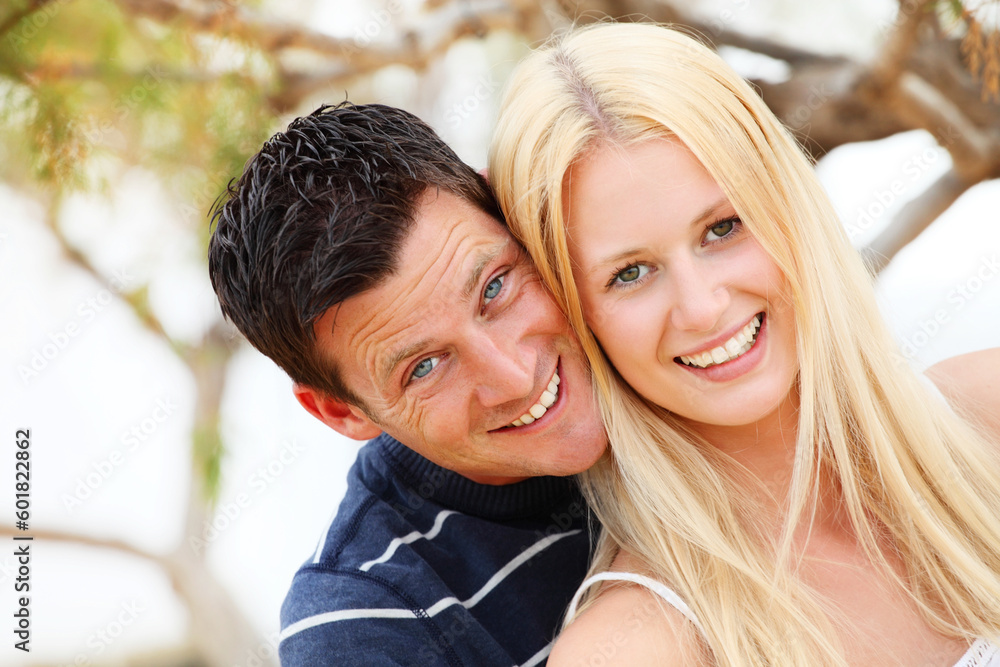 Young happy couple. Shallow DoF with focus on the woman. Young happy couple. Shallow DoF with focus on the woman.