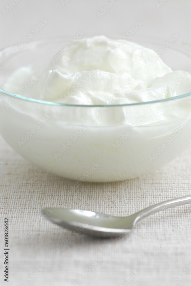 Fresh yogurt served in a clear glass bowl Fresh yogurt served in a clear glass bowl