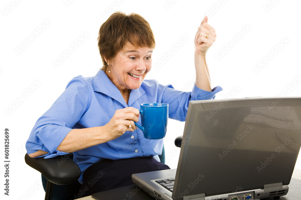 Woman drinking coffee and reading exciting news on the internet.