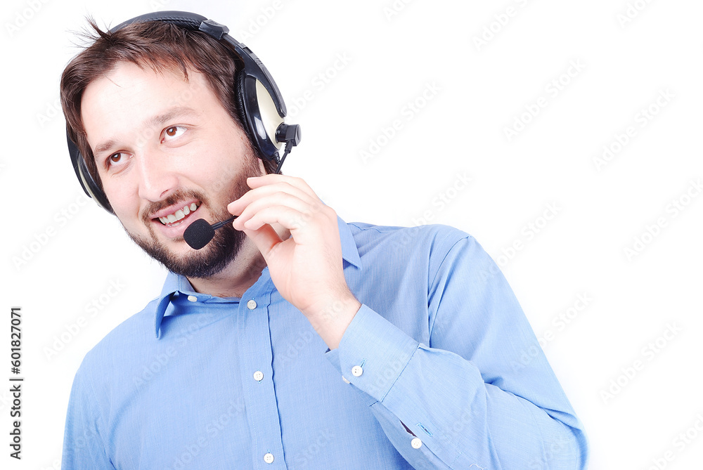 Young attractive man is speaking on microphone and putting headphones on head Young attractive man is speaking on microphone and putting headphones on head