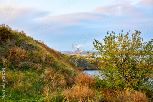 Autumn landscape with big river and blue sky.