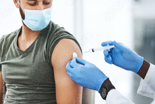 Covid  vaccine and man doctor with cotton in healthcare consultation for safety or prevention. Corona  vaccination and arm injection for guy person by physician in gloves for hospital compliance