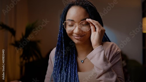 Close-up portrait of a smiling female student journalist, experiencing satisfaction by her article photo