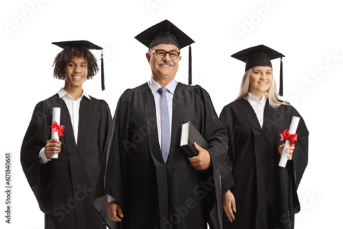 Univeristy dean and graduate students posing in gowns photo