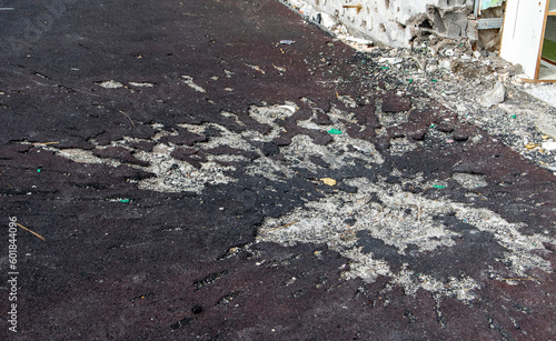 War in Ukraine. Funnel from the explosion in the asphalt. The trace left by the explosion of an artillery shell. Consequences of the rocket attack.