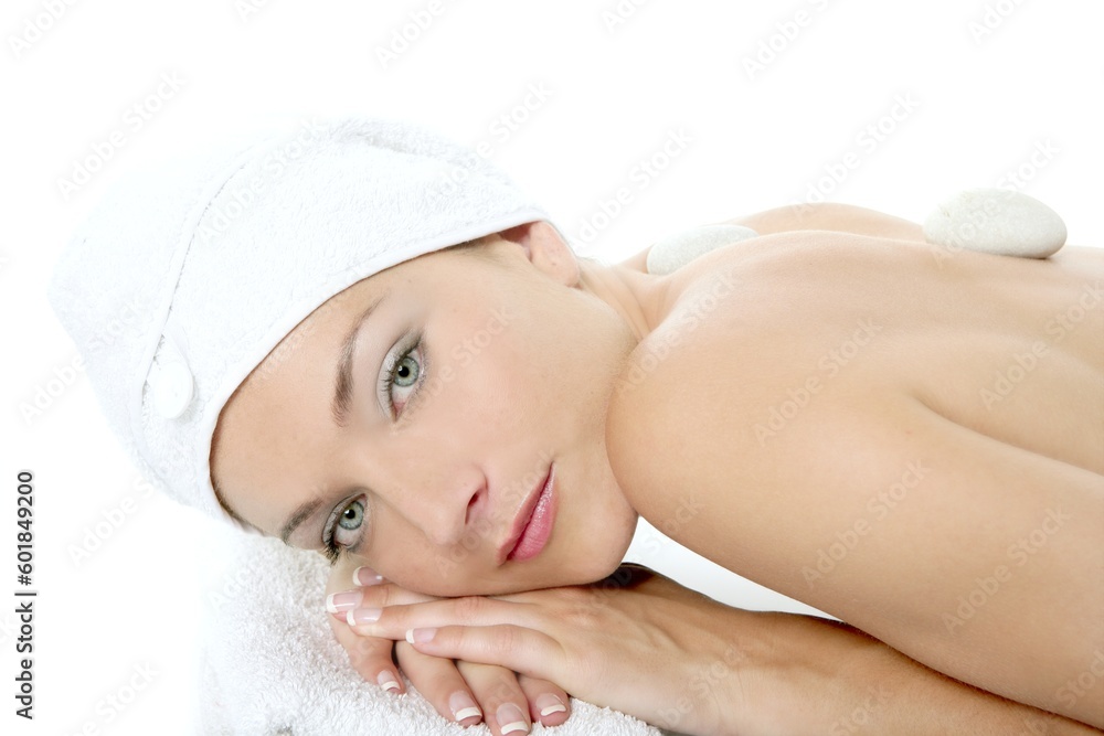 Beautiful woman relaxed on spa with stone treatment, white background Beautiful woman relaxed on spa with stone treatment, white background