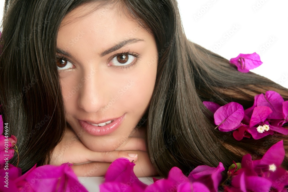 Beautiful indian woman portrait with bougainvilleas flowers over white Beautiful indian woman portrait with bougainvilleas flowers over white