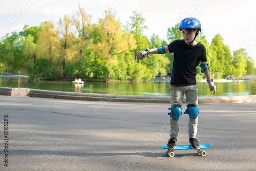 boy riding a skateboard in the park