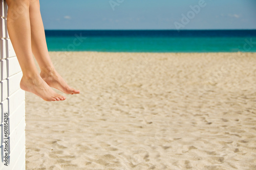 Woman relaxing on the beach on a sunny day