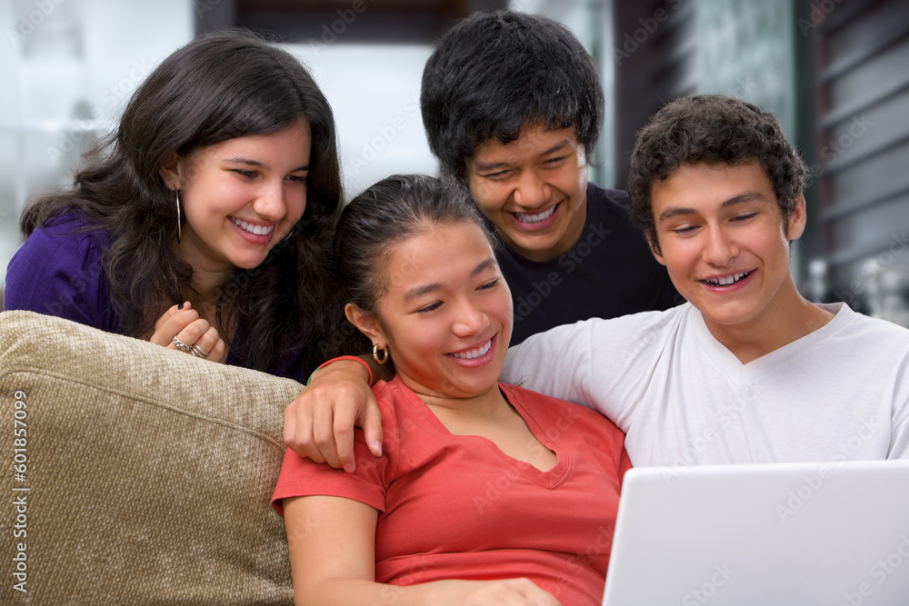 Teenagers watching something interesting on laptop at home. Teenagers watching something interesting on laptop at home.