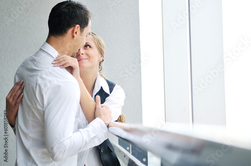 romantic happy couple relax and have fun at balcony in their new home apartment