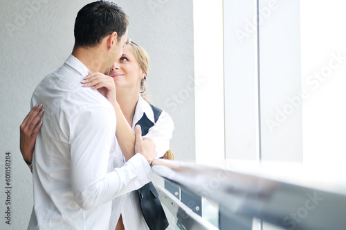 romantic happy couple relax and have fun at balcony in their new home apartment