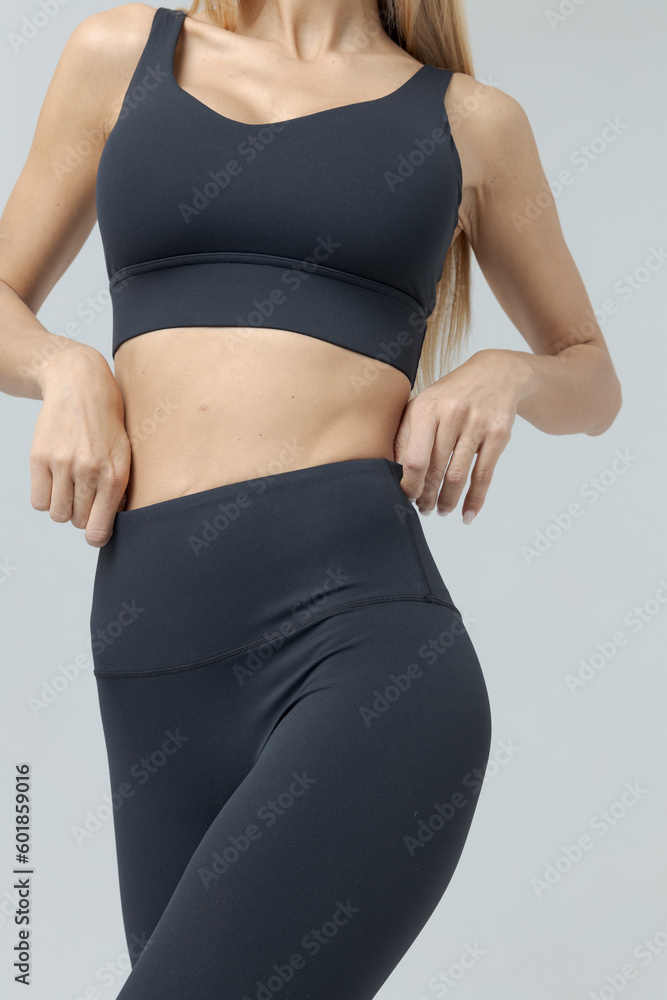 Fototapeta premium a girl in a white tracksuit on a white background