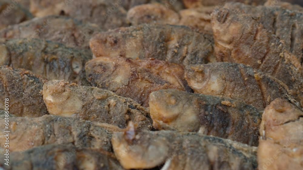 Fried small carp, close-up. Delicious river fish crucian neatly laid out and ready to eat Fried small carp, close-up. Delicious river fish crucian neatly laid out and ready to eat