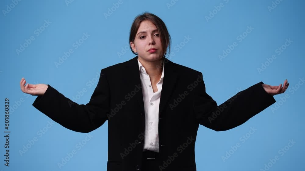 4k video of one girl thinking about something on blue background. 4k video of one girl thinking about something on blue background.