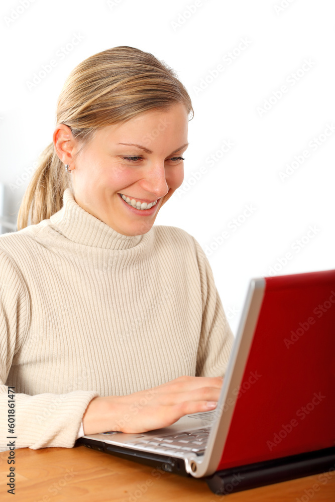young blonde businesswoman working with her laptop and smiling young blonde businesswoman working with her laptop and smiling