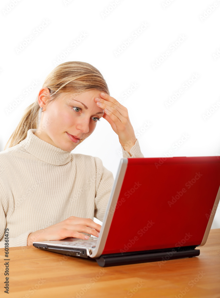 friendly blonde businesswoman with laptop intent in her work friendly blonde businesswoman with laptop intent in her work