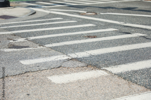 Crosswalk symbolizes pedestrian safety, accessibility, and shared spaces. It represents the designated area for pedestrians to safely cross roads, promoting harmony between pedestrians and vehicles