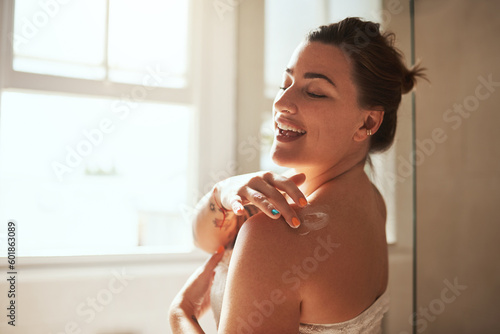 Obraz na plátně Skincare, cream and woman in bathroom for wellness, moisturizer and apply lotion for healthy skin