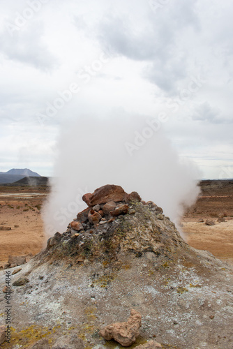Fumarole evacuating pressurized hot sulphurous gases from volcanic activity in a geothermal area of Iceland