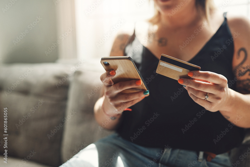 Phone, credit card and woman hands on sofa for online shopping, e commerce and fintech payment, loan or finance. Person on couch typing banking information on mobile app for home and web transaction Phone, credit card and woman hands on sofa for online shopping, e commerce and fintech payment, loan or finance. Person on couch typing banking information on mobile app for home and web transaction