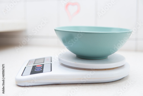 a bowl on a kitchen scale. Weighing food
