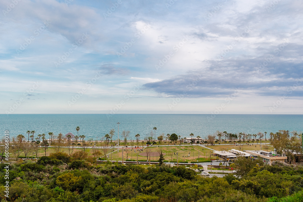 View from a height of the park near the sea in the city of Antalya. Prak in the Konyalti region near the sea from a height.