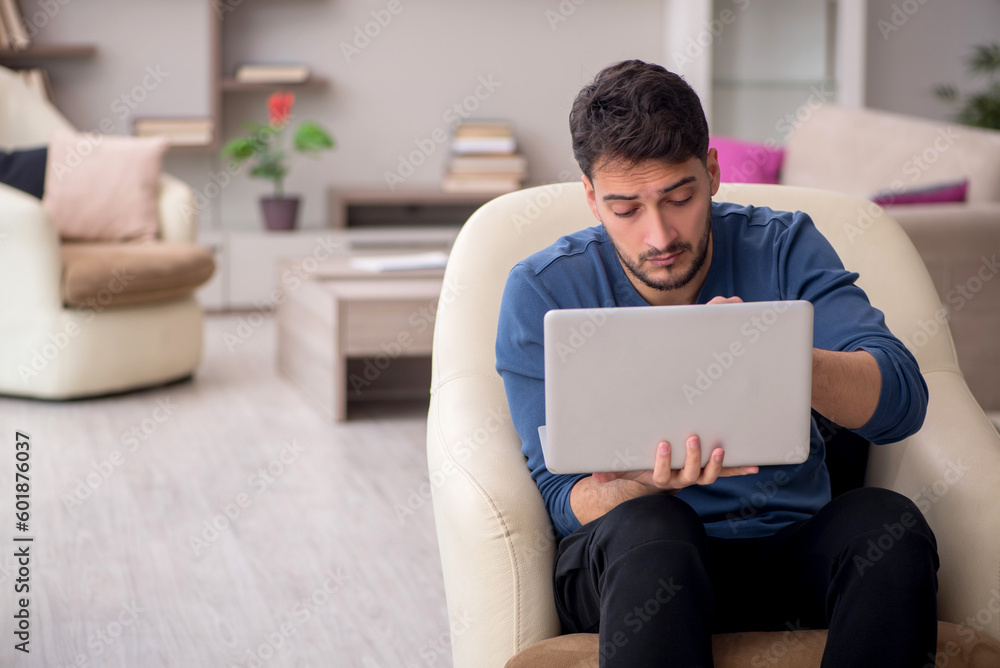 Young man working from home during pandemic Young man working from home during pandemic