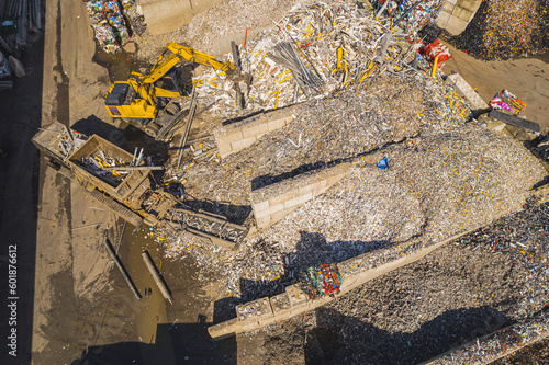 Fotografija Drone view over metal recycling plant - heavy machinery shredding the scrap, Netherlands