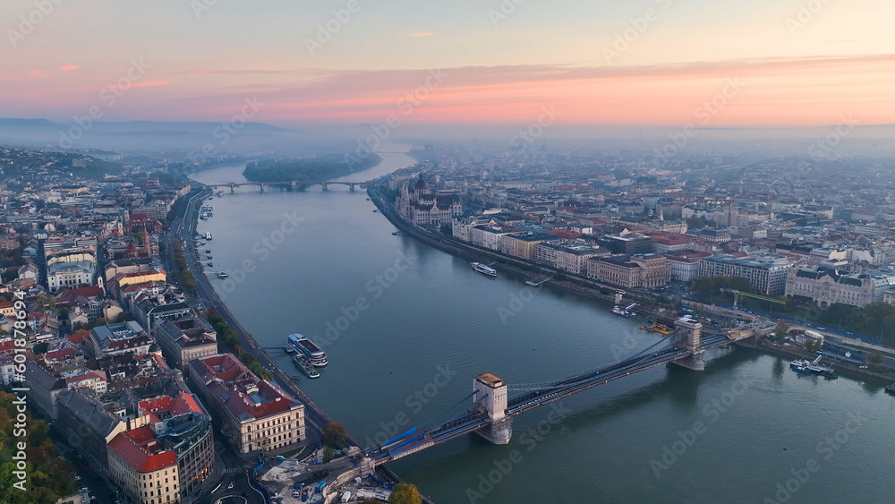 Fototapeta premium Aerial view of Hungarian Parliament Building at sunrise with the Danube river, in Budapest, Hungary