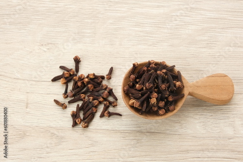 Dried cloves (cengkeh), dried herbs served in small bowl
 photo